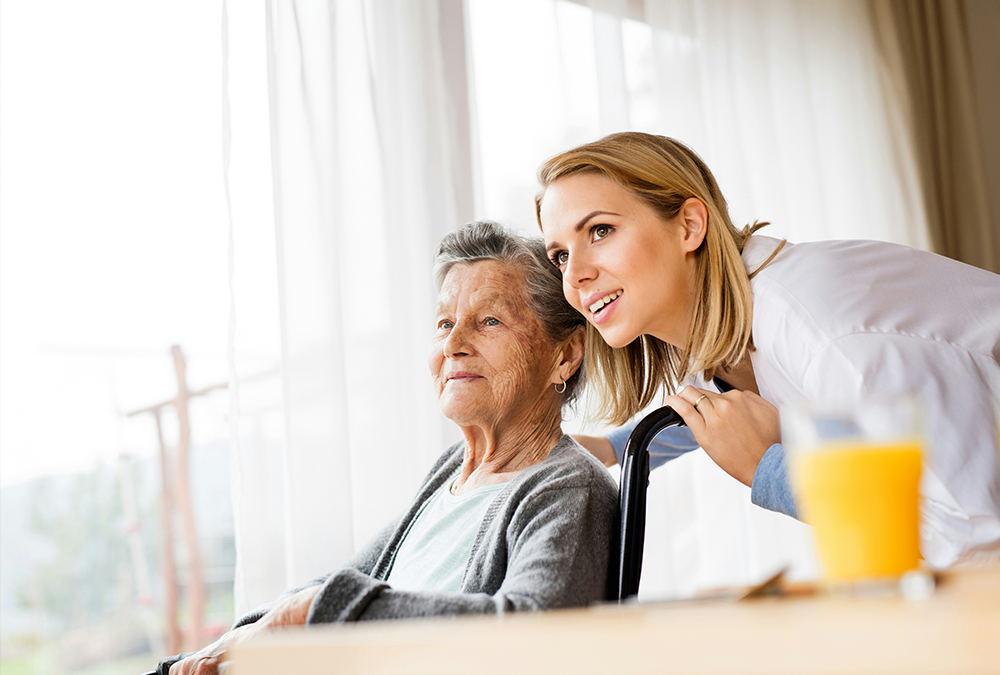 Female carer with elderly woman